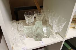 A moulded glass church shaped paperweight together with Waterford and Stewart glassware.