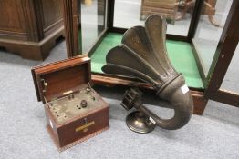 An Amplion plywood and Bakelite horn shaped speaker together with a BBC Gecophone.