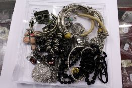 A good collection of costume necklaces and bracelets.