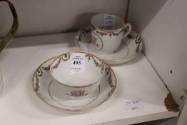A Chinese export floral decorated tea bowl and saucer with matching cup and saucer.