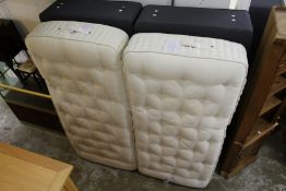 A good king size bed with a pair of zip together Somnus mattresses on box bases.