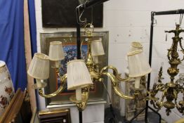 A brass six branch chandelier.