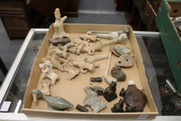 A small collection of antiquities, to include glass bottles, oil lamps, terracotta figures and