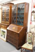 A George III mahogany and satinwood inlaid bureau bookcase (lacking cornice).