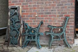 Three pairs of cast metal bench ends together with a seat and a back from one bench.