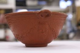 A good small classical style moulded porcelain bowl with terracotta glaze.