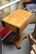 A 19th century mahogany drop flap pedestal work table.