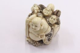 A Chinese large carved ivory netsuke.