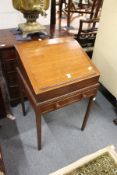 A 19th century oak clerk's desk, the removable upper section with rising top on a base with a single