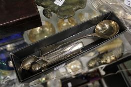 A Victorian silver sauce ladle, two egg spoons, a mustard spoon, all hallmarked London 1876.
