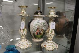 A Dresden vase and cover and a pair of Coalport candlesticks.