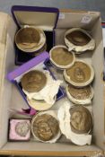 Ten boxed bronze medallions and two other items.