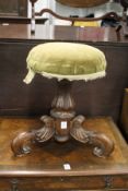 19th century rosewood revolving piano seat with carved scrolling feet.