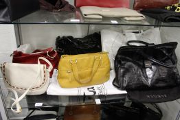 Various ladies' handbags.