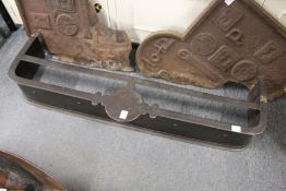 A steel fender footman.