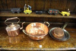A copper kettle, a small preserve pan and three frying pans.