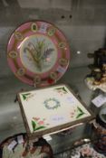 A cabinet plate, pink ground with gilt decoration, the centre painted with a floral spray,