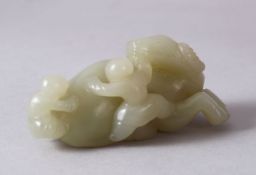 A CHINESE CARVED JADE FIGURE OF AN OXEN AND ATTENDANTs, The oxen in a recumbent position with two