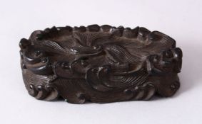 A CHINESE MOULDED WAVE STAND, in the form of crashing waves, 12cm wide x 5.5cm.
