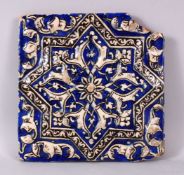 A QAJAR MOULD POTTERY TILE, 24cm square.