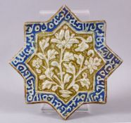 A SELJUK KASHAN STAR SHAPED POTTERY TILE, possibly 13th century, the central panel moulded with
