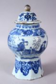 A CHINESE BLUE & WHITE OCTAGONAL FORMED JAR & COVER, the jar decorated with scenes of figures in