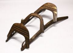 A LARGE WOOD & METAL POSSIBLY EGYPTIAN CAMEL SADDLE / SEAT, the timbers enclosed and decorated