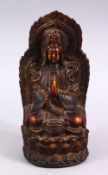 A GOOD CHINESE CARVED IVORY STYLE FIGURE OF SEATED GUANYIN, seated upon a lotus base, with her hands