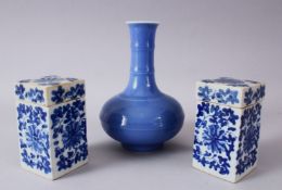 A PAIR OF CHINESE BLUE AND WHITE SQUARE FORM PORCELAIN CANISTERS AND COVERS, each box decorated with