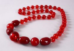A GOOD SET OF CHERRY AMBER ROSARY BEAD NECKLACE, with graduating bead size, approx open size 84cm.