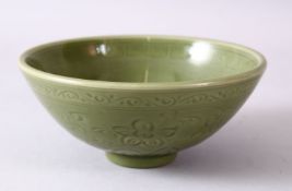 A 19TH/20TH CENTURY CHINESE CARVED LONGQUAN CELEDON BOWL, with carved stylised floral decoration,