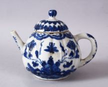 A 19TH / 20TH CENTURY CHINESE BLUE & WHITE PORCELAIN TEAPOT, decorated with f lotus display, and