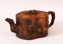 A CHINESE YIXING TEAPOT, of naturalistic form, 20cm wide.