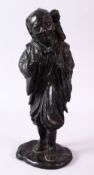 A GOOD 19TH CENTURY JAPANESE BRONZE FIGURE OF A MAN, a monkey on his back, 33cm high.
