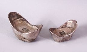 TWO PIECES OF CHINESE WHITE METAL POSSIBLY SILVER SHOE CURRENCY, 7cm and 6.5cm.
