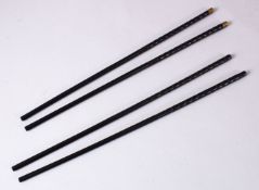 TWO PAIRS OF CHINESE CARVED EBONY CHOPSTICKS, each carved and one set with metal tops, both 29cm.