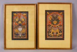 A PAIR OF INDIAN MINIATURE FRAMED PAINTINGS, each decorated with displays of native flora, one
