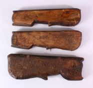 THREE INDIAN CARVED WOODEN SPICE BOXES, largest 40cm long.