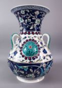 A LARGE TURKISH OTTOMAN STYLE CERAMIC FLORAL LAMP VASE, with three moulded handles and three bosses,