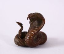 A JAPANESE BRONZE MODEL OF A COBRA SNAKE, intertwined, signed, 4.5cm.
