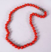 A 19TH / 20TH CENTURY CHINESE CARVED CORAL NECKLACE, Comprising 49 carved beads, approx 60gms,