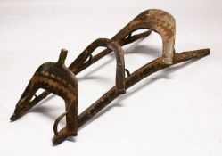 A LARGE WOOD & METAL POSSIBLY EGYPTIAN CAMEL SADDLE / SEAT, the timbers enclosed and decorated
