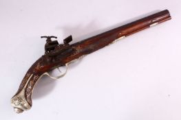 AN 18TH CENTURY INDIAN FLINTLOCK PISTOL, with gold inlaid barrel, carved stone, profusely inlaid