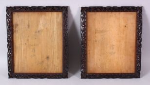 A PAIR OF 19TH CENTURY CHINESE CARVED WOOD PICTURE FRAMES, carved with prunus and scroll decoration,