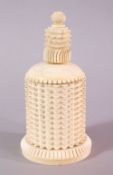 A 19TH CENTURY CARVED IVORY CYLINDRICAL BOX AND COVER - the cover possibly a marriage, 15cm.