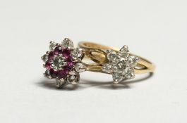 TWO 18CT GOLD FLOWER CLUSTER RINGS.