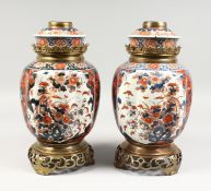 A VERY GOOD PAIR OF SAMSON OF PARIS IMARI PATTERN LAMPS, rich colours, in gilt, reds and blues.