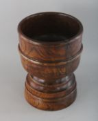 A CARVED WOOD MORTAR. 8ins high.