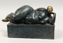 A SMALL BRONZE ABSTRACT RECLINING FEMALE NUDE, on a plinth base. 12ins long.