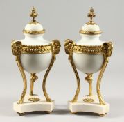 A VERY GOOD PAIR OF LOUIS XVI STYLE WHITE MARBLE AND ORMOLU CASSOLETTES with rams masks on hoof